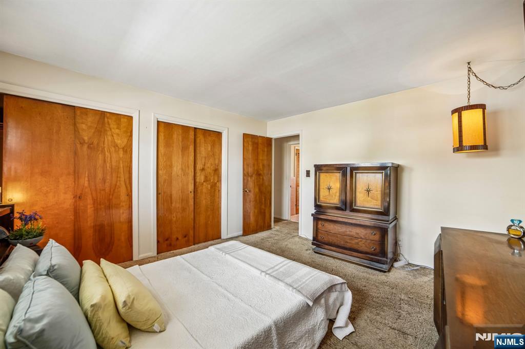 31 Division Street Bloomfield, NJ 07003 - Photo 21 of 30 a bedroom with a bed and dresser