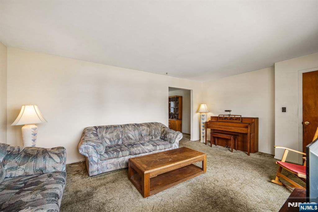 31 Division Street Bloomfield, NJ 07003 - Photo 7 of 30 a living room with furniture and a couch