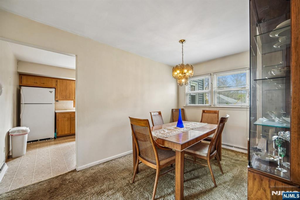 31 Division Street Bloomfield, NJ 07003 - Photo 8 of 30 a dining room with furniture a chandelier and wooden floor