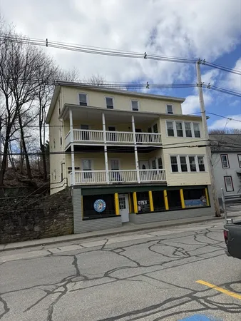 a front view of a building with glass windows