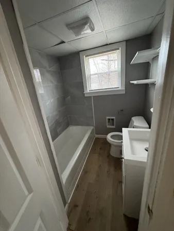a bathroom with a sink and toilet