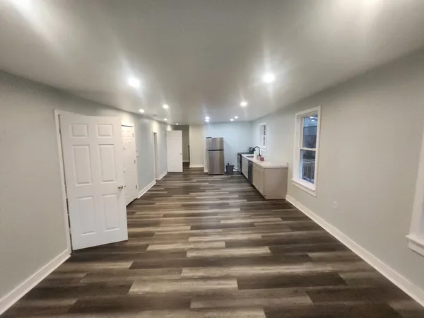 a spacious bathroom with a sink and a mirror