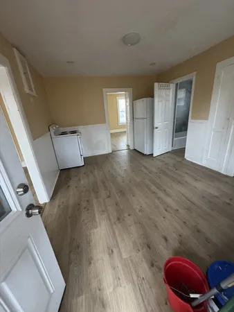 a view of livingroom and hardwood floor