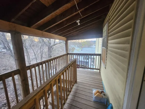 a view of hallway with wooden floor