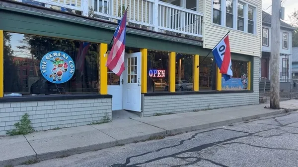 a view of small shop in front of building