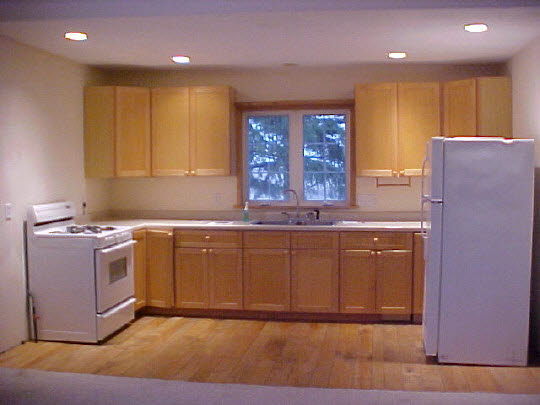 2096 South Hoosier Road Franklin Grove, IL 61031 - Photo 3 of 6 a kitchen with kitchen island granite countertop wooden cabinets a sink and a stove