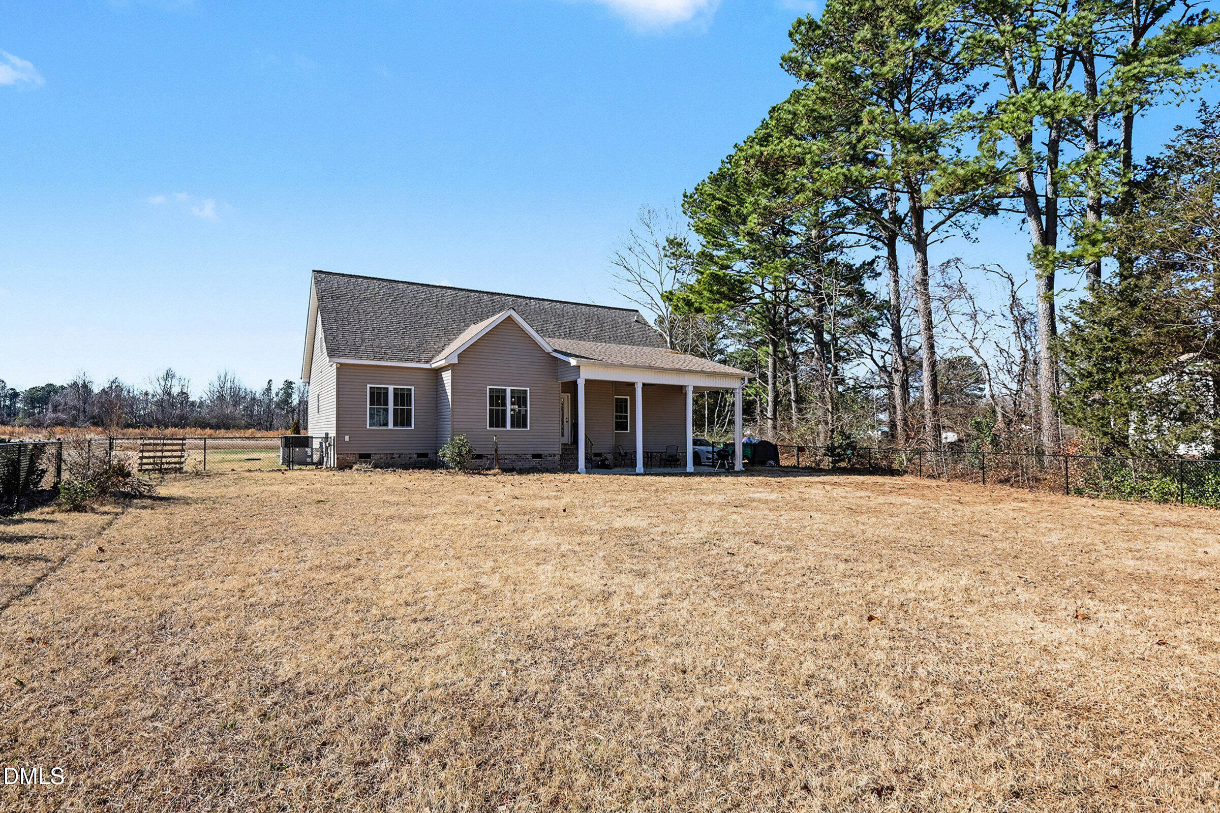 5117 Joe Ellen Road Battleboro, NC 27809 - Photo 20 of 23 a front view of a house with a yard