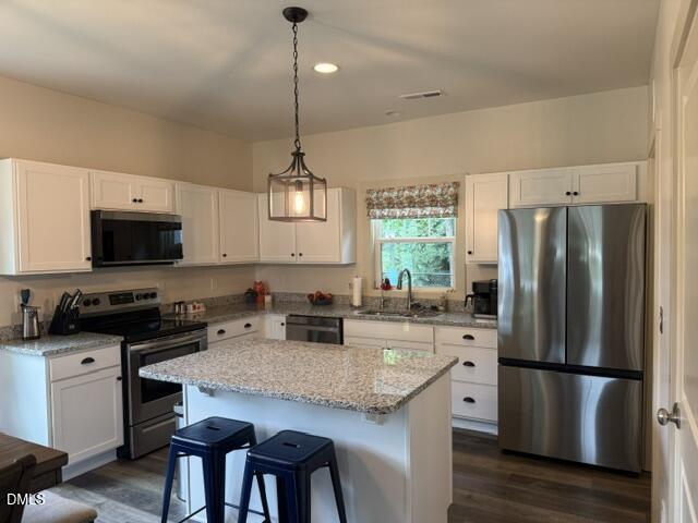 574 East Ridge Avenue Liberty, NC 27298 - Photo 6 of 28 a kitchen with refrigerator a stove a sink and a refrigerator