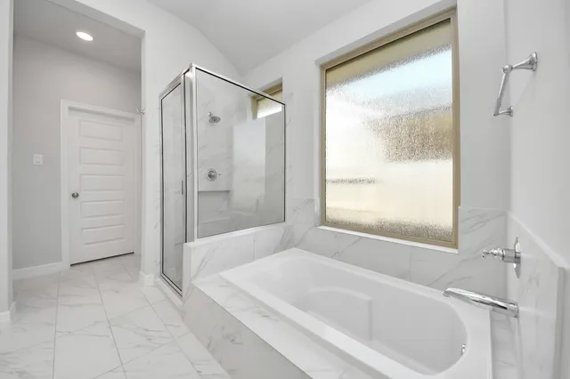 a spacious bathroom with double sink and a mirror