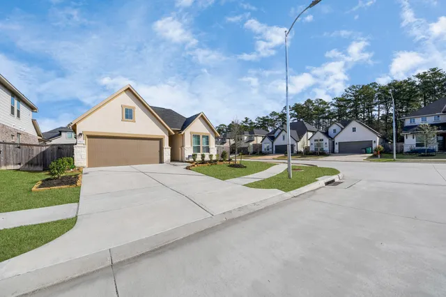 a view of big house with entertaining space and a yard