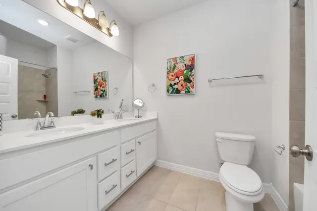 a bedroom with a bed and a lamp on table