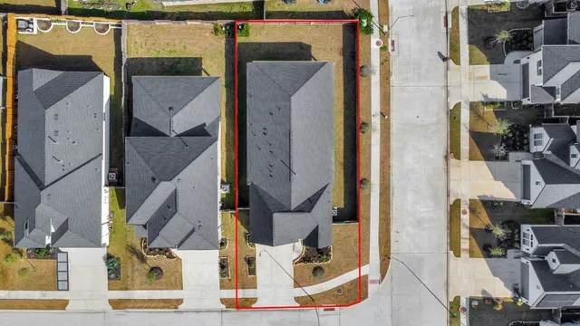 an aerial view of residential houses with outdoor space