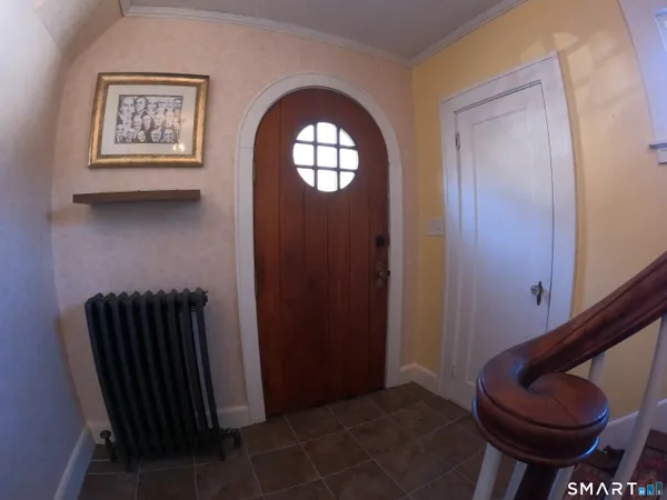 a view of entryway with wooden floor