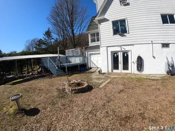 a view of a backyard with a car parked in it