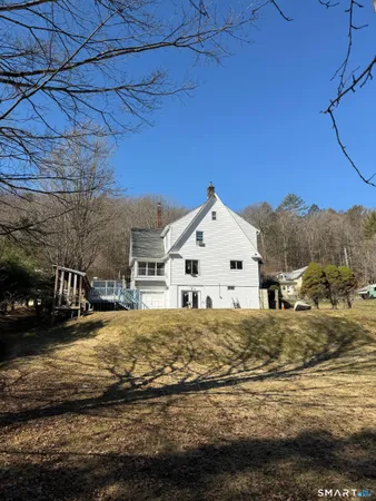 a view of large house with a yard