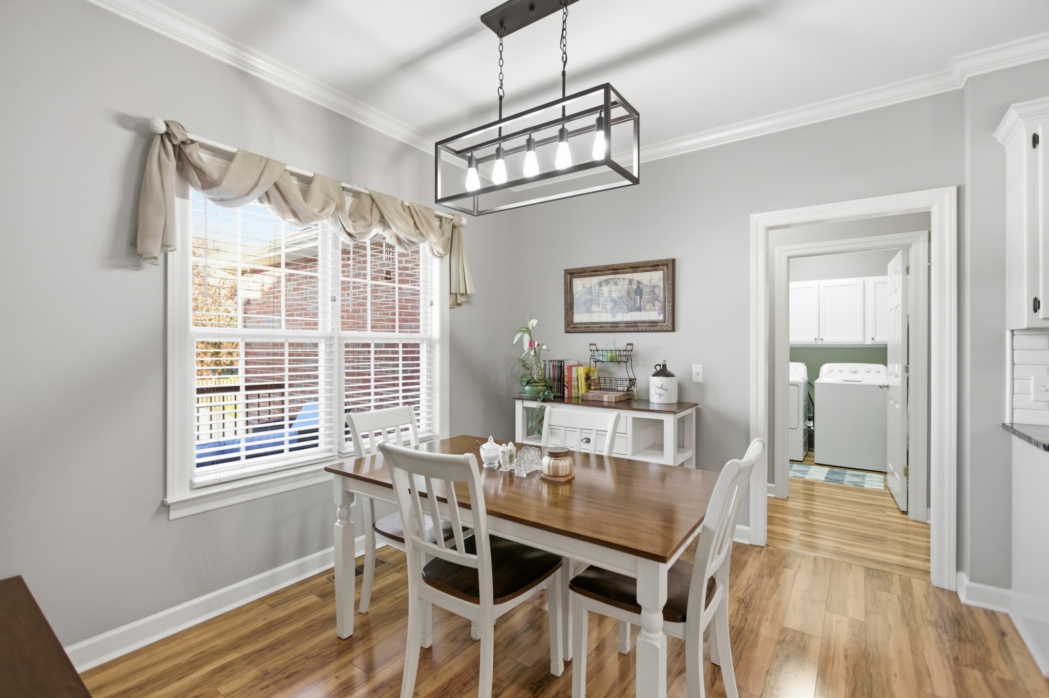 431 Ovoca Lake Road Tullahoma, TN 37388 - Photo 15 of 58 a dining room with wooden floor and chandelier