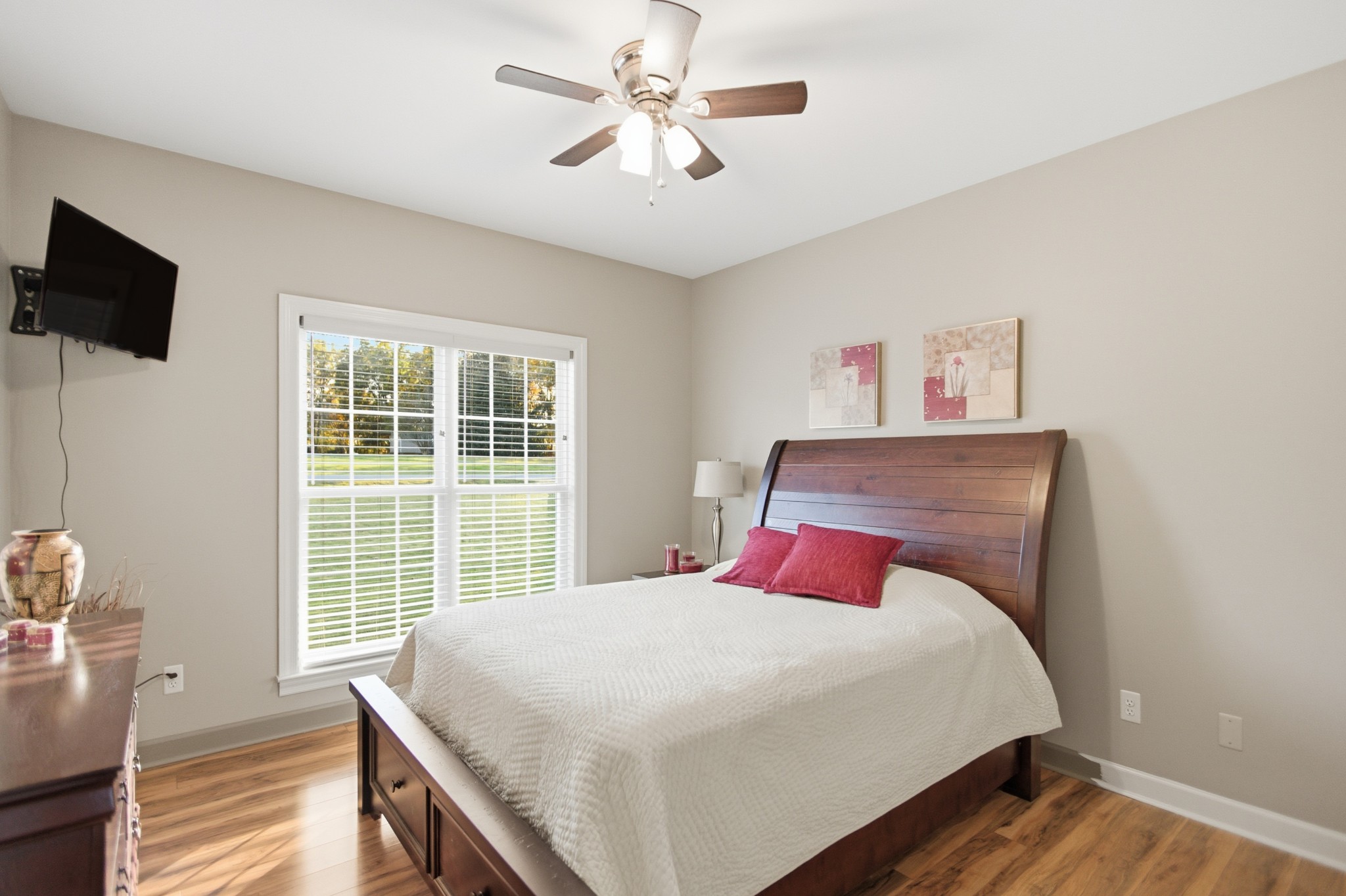 431 Ovoca Lake Road Tullahoma, TN 37388 - Photo 22 of 58 a bedroom with a large bed and a flat tv screen on dresser