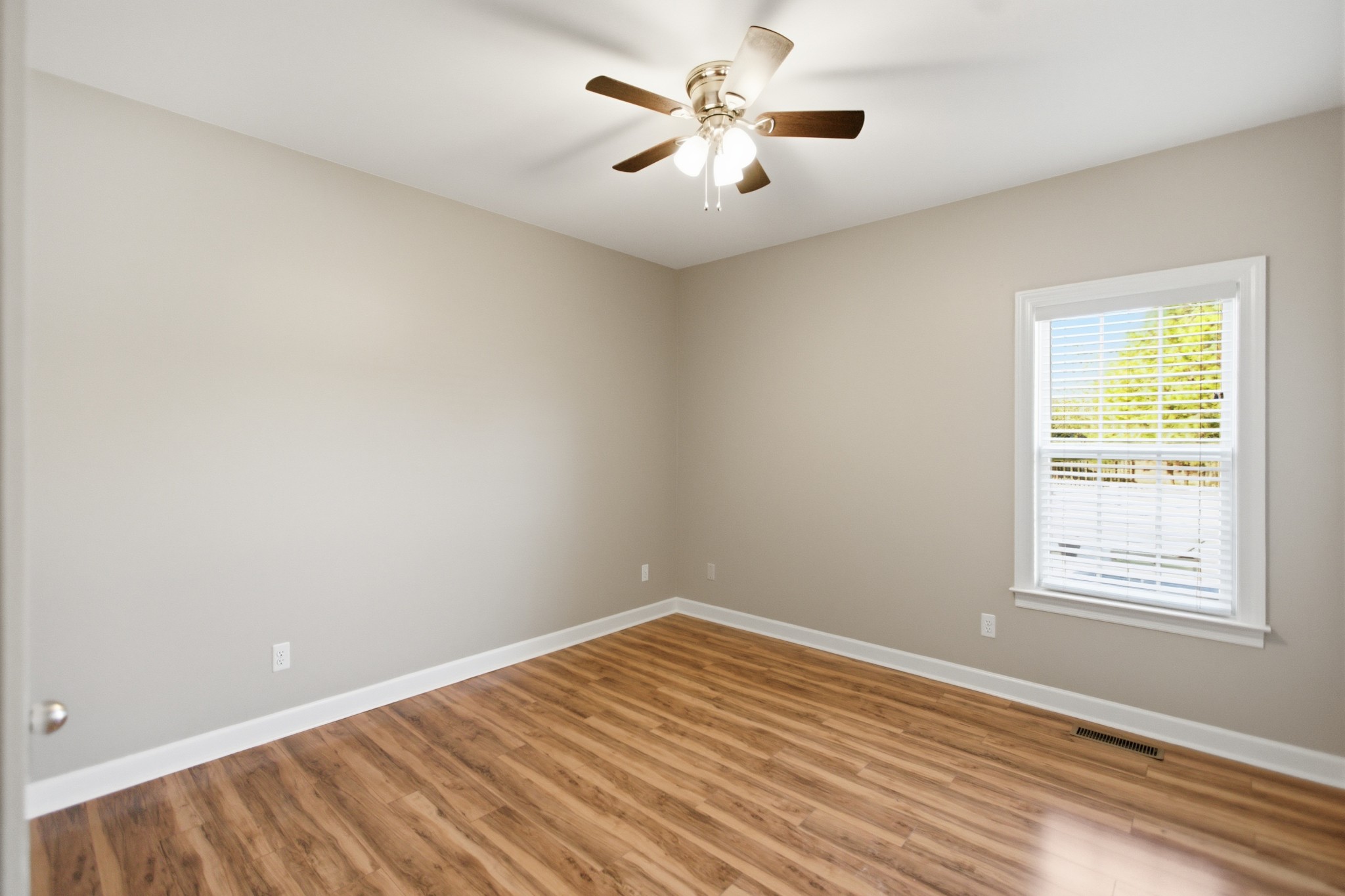 431 Ovoca Lake Road Tullahoma, TN 37388 - Photo 24 of 58 wooden floor in an empty room with a window