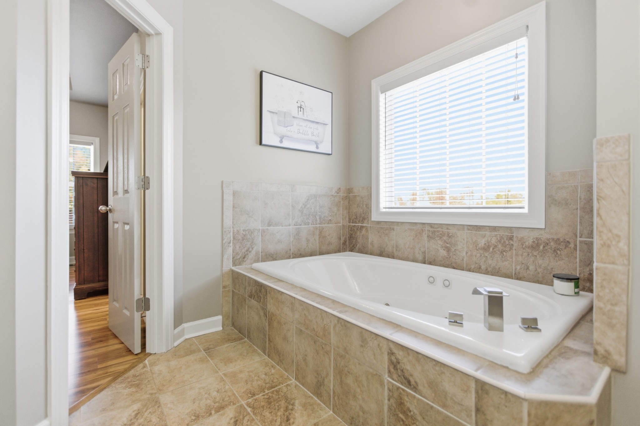 431 Ovoca Lake Road Tullahoma, TN 37388 - Photo 30 of 58 a white bath tub sitting in a bathroom next to a window
