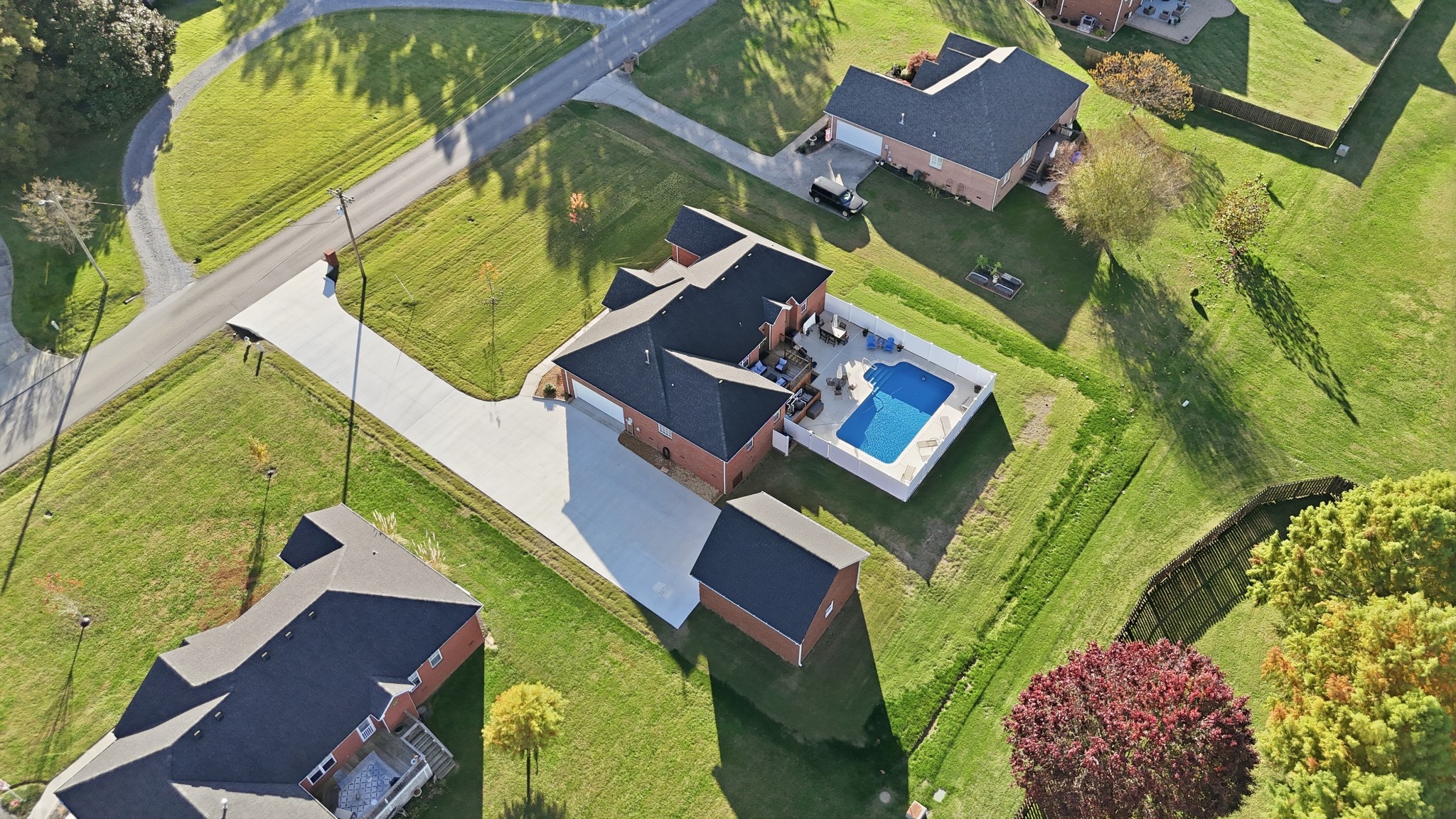 431 Ovoca Lake Road Tullahoma, TN 37388 - Photo 3 of 58 an aerial view of a house with a yard and swimming pool