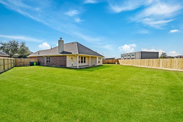 a house view with a big yard