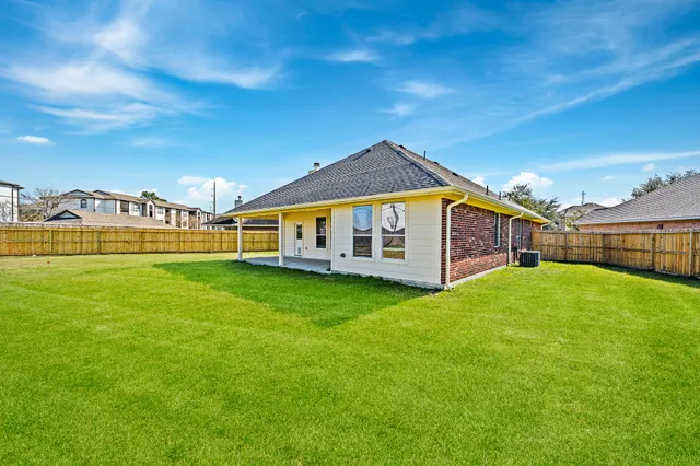 a view of a house with a big yard