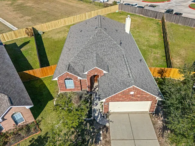an aerial view of a house with swimming pool