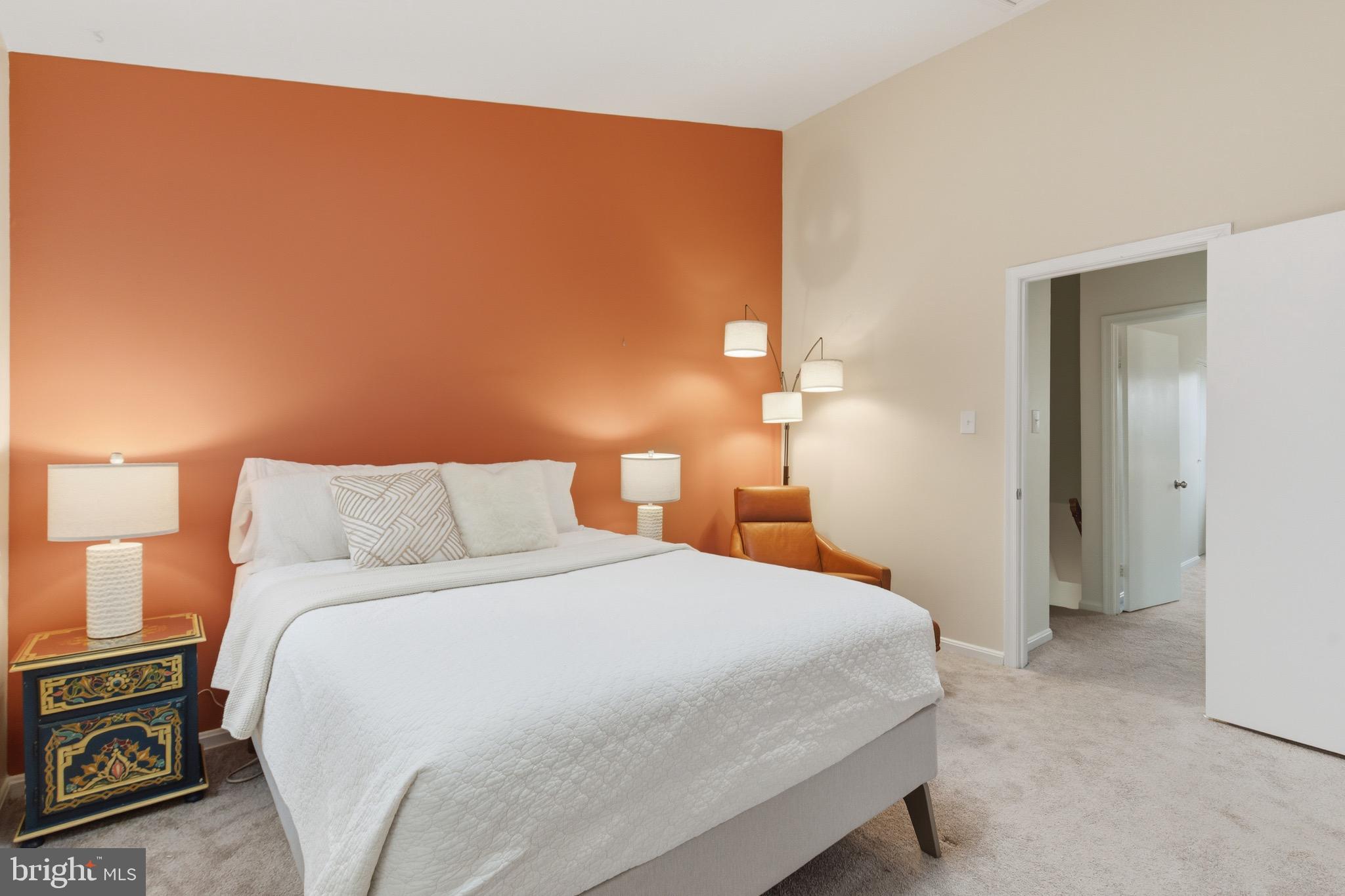 517 Pickwick Village Way Silver Spring, MD 20901 - Photo 16 of 39 a bedroom with a bed and a lamp