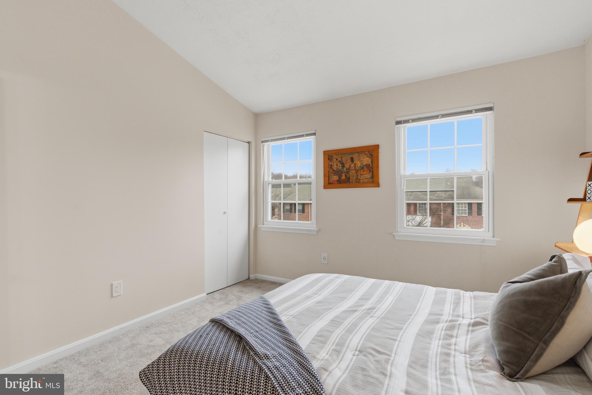 517 Pickwick Village Way Silver Spring, MD 20901 - Photo 23 of 39 a bedroom with a bed and a window