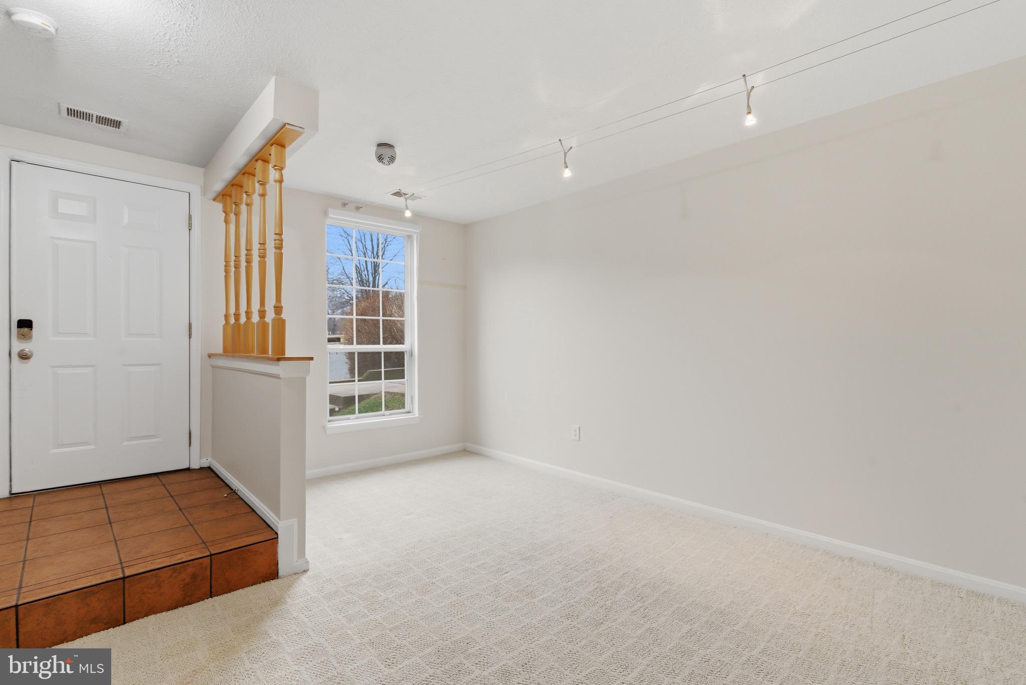 517 Pickwick Village Way Silver Spring, MD 20901 - Photo 27 of 39 an empty room with windows