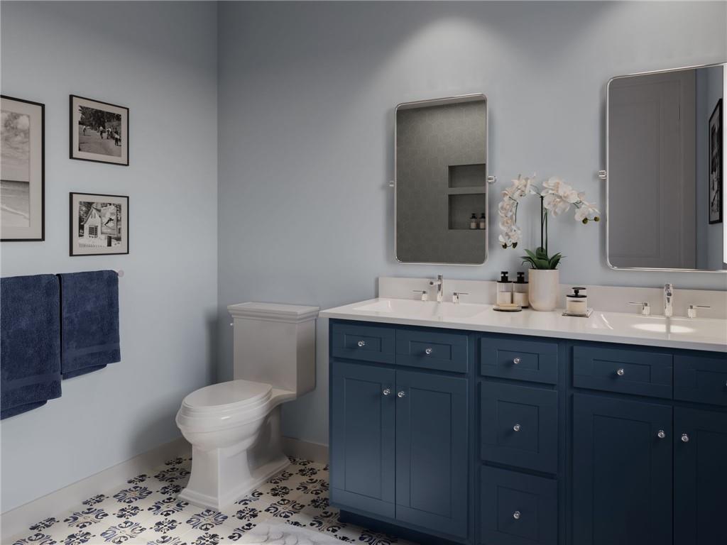 902 Reeb Way Cranberry Township, PA 16066 - Photo 20 of 31 a bathroom with a toilet sink and mirror