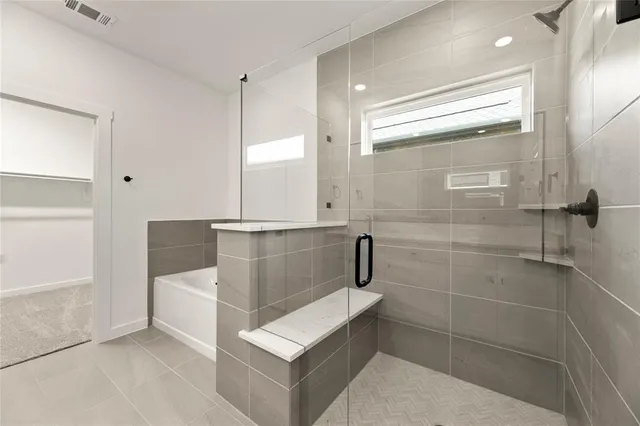 a bathroom with a shower and a sink