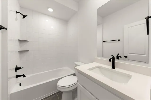 a bathroom with a sink a toilet and a tub