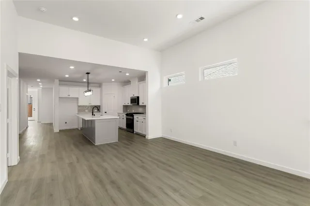 a view of kitchen with wooden floor