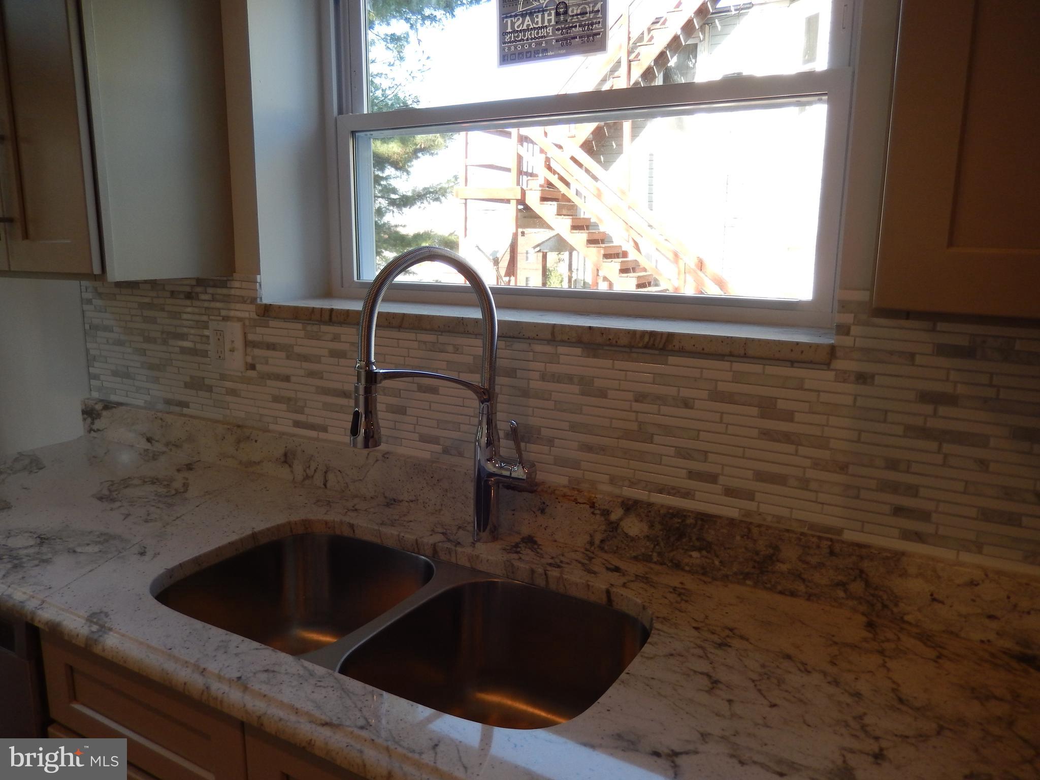 5014 Catalpha Road Baltimore, MD 21214 - Photo 22 of 63 a close view of sink and tap