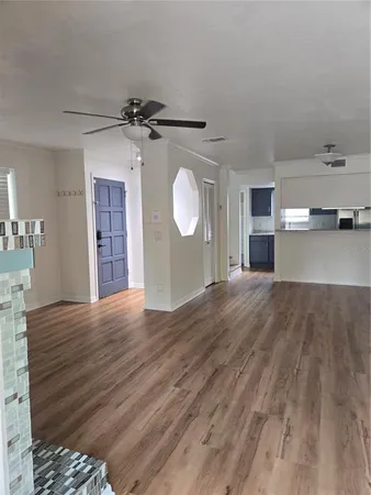 a view of a livingroom with wooden floor