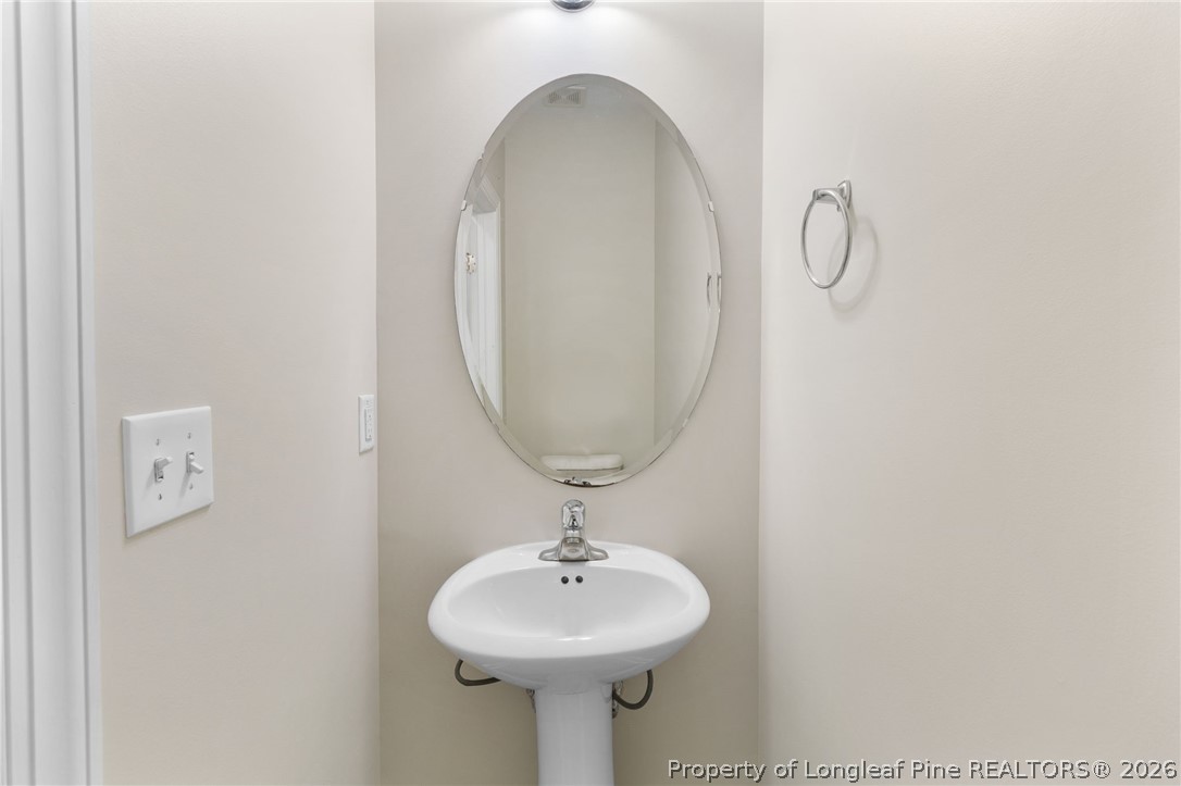 50 Huzzas Circle Cameron, NC 28326 - Photo 17 of 39 a bathroom with a sink and a mirror