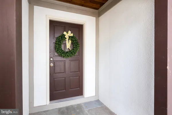 a view of a hallway with wooden door