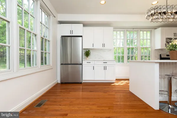 a kitchen with stainless steel appliances a refrigerator and a sink