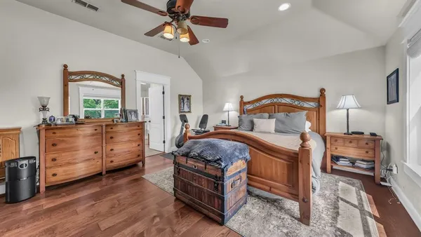 a bed room with a bed and a chandelier