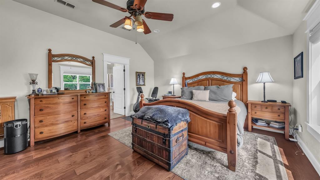 2691 Farm To Market Road 730 North Decatur, TX 76234 - Photo 17 of 36 a bed room with a bed and a chandelier