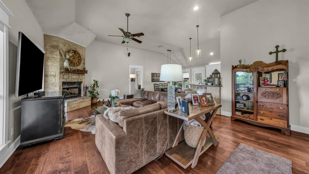2691 Farm To Market Road 730 North Decatur, TX 76234 - Photo 5 of 36 a living room with furniture a flat screen tv and kitchen view
