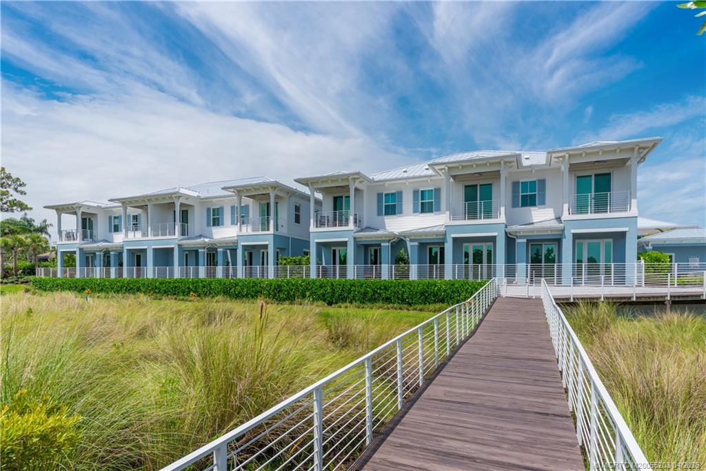 4683 Southeast Manatee Terrace Stuart, FL 34997 - Photo 2 of 45 a view of residential building with lake view