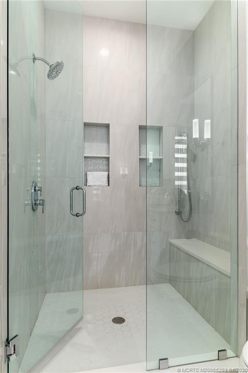 4683 Southeast Manatee Terrace Stuart, FL 34997 - Photo 29 of 45 a bathroom with a shower