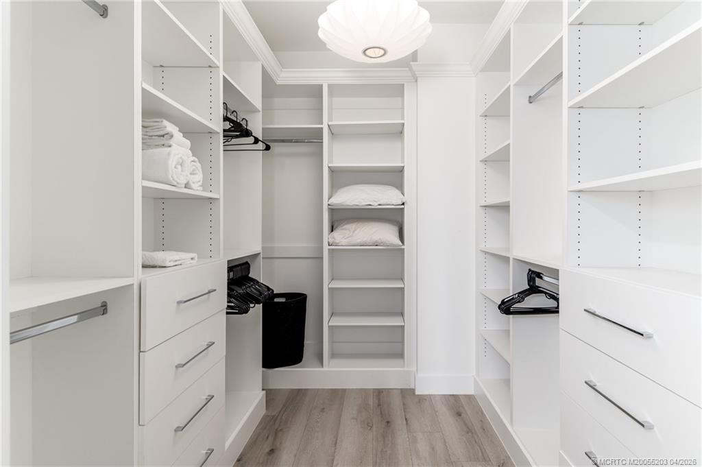 4683 Southeast Manatee Terrace Stuart, FL 34997 - Photo 30 of 45 a view of walk in closet with empty racks