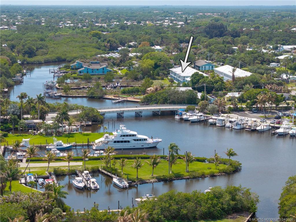 4683 Southeast Manatee Terrace Stuart, FL 34997 - Photo 3 of 45 an aerial view of residential houses with outdoor space