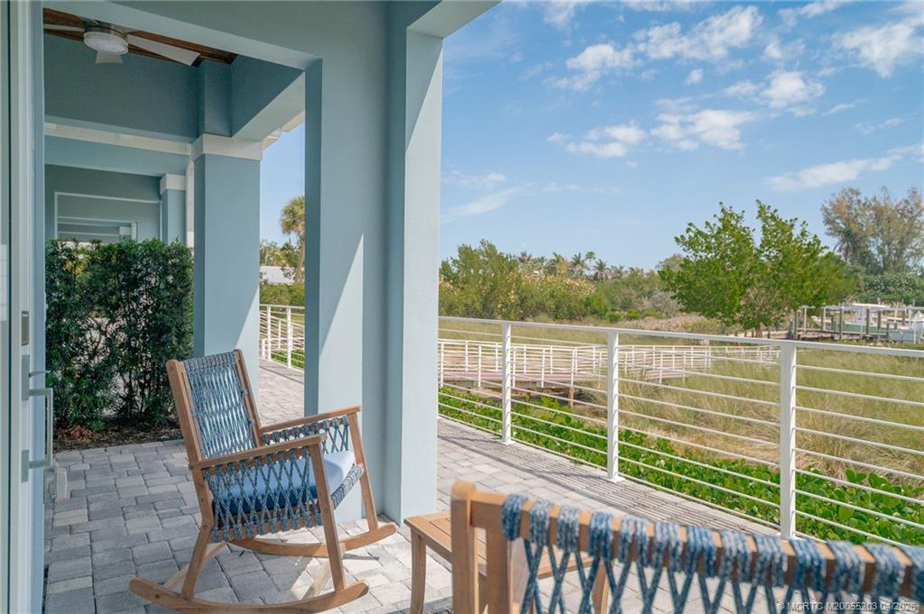 4683 Southeast Manatee Terrace Stuart, FL 34997 - Photo 39 of 45 a view of a chair and table in the balcony