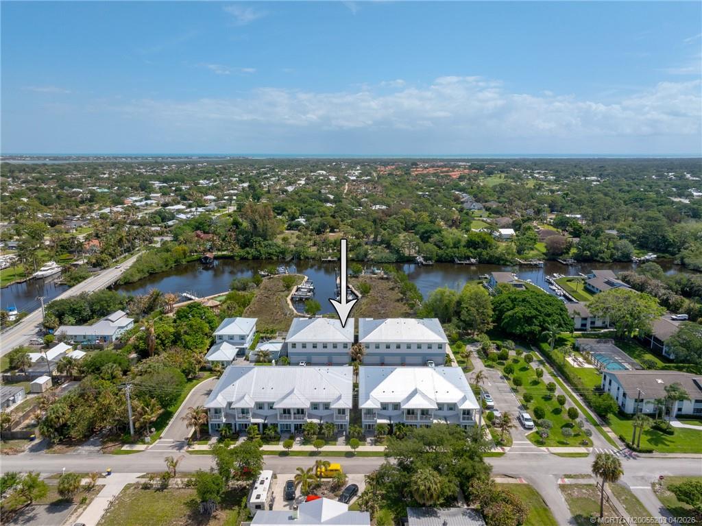 4683 Southeast Manatee Terrace Stuart, FL 34997 - Photo 43 of 45 an aerial view of a city with houses
