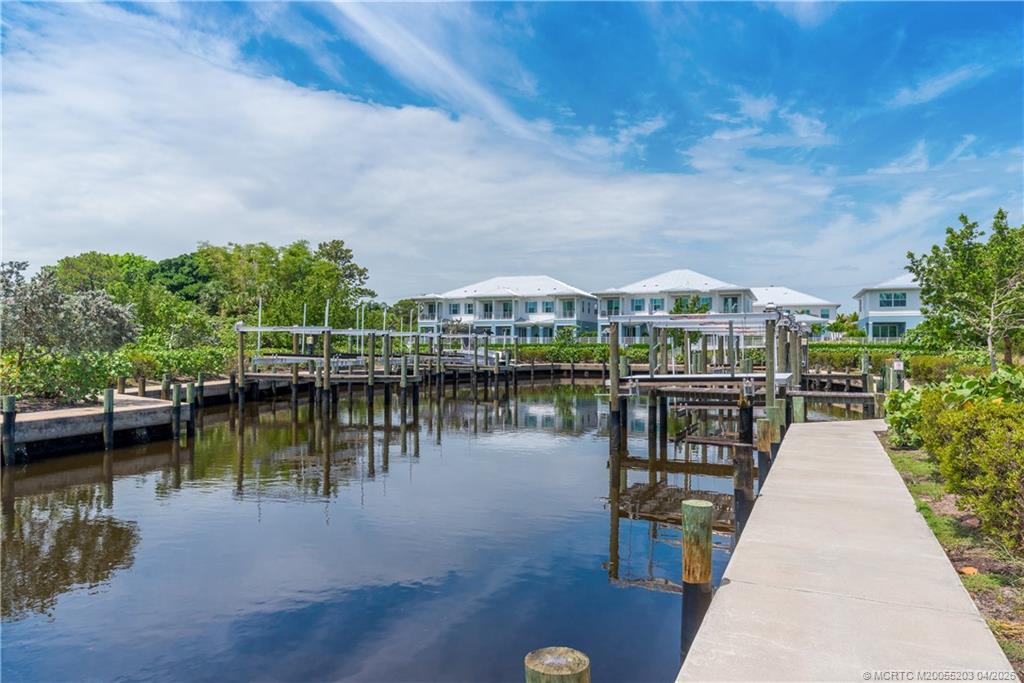 4683 Southeast Manatee Terrace Stuart, FL 34997 - Photo 7 of 45 a view of a lake with a lake in the background