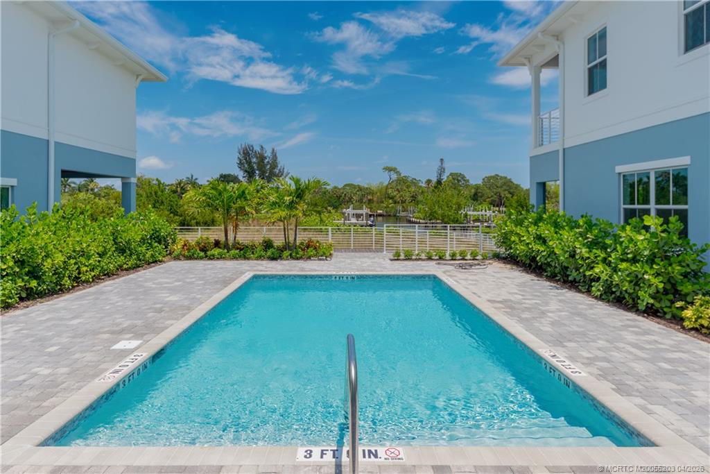 4683 Southeast Manatee Terrace Stuart, FL 34997 - Photo 9 of 45 a view of a backyard